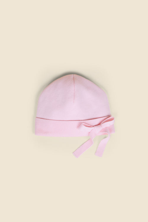 Soft pink infant hat with ribbed trim and an elegant bow detail, providing a cozy and stylish accessory for babies.