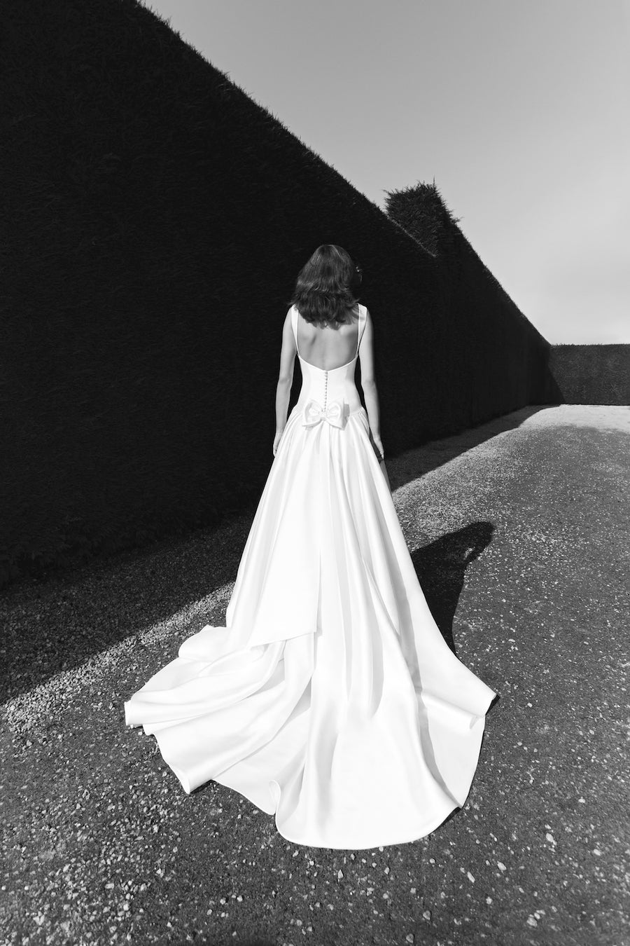 Viktor & Rolf Mariage Bridalwear Collection, Mikado clean cut gown, elegant and timeless with sleek silhouette and modern bow detail.