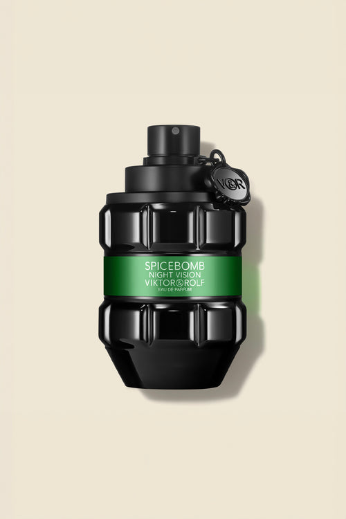 Bold grenade-shaped bottle of Spicebomb Eau de Parfum for men by Viktor & Rolf, with a sleek black and green design.