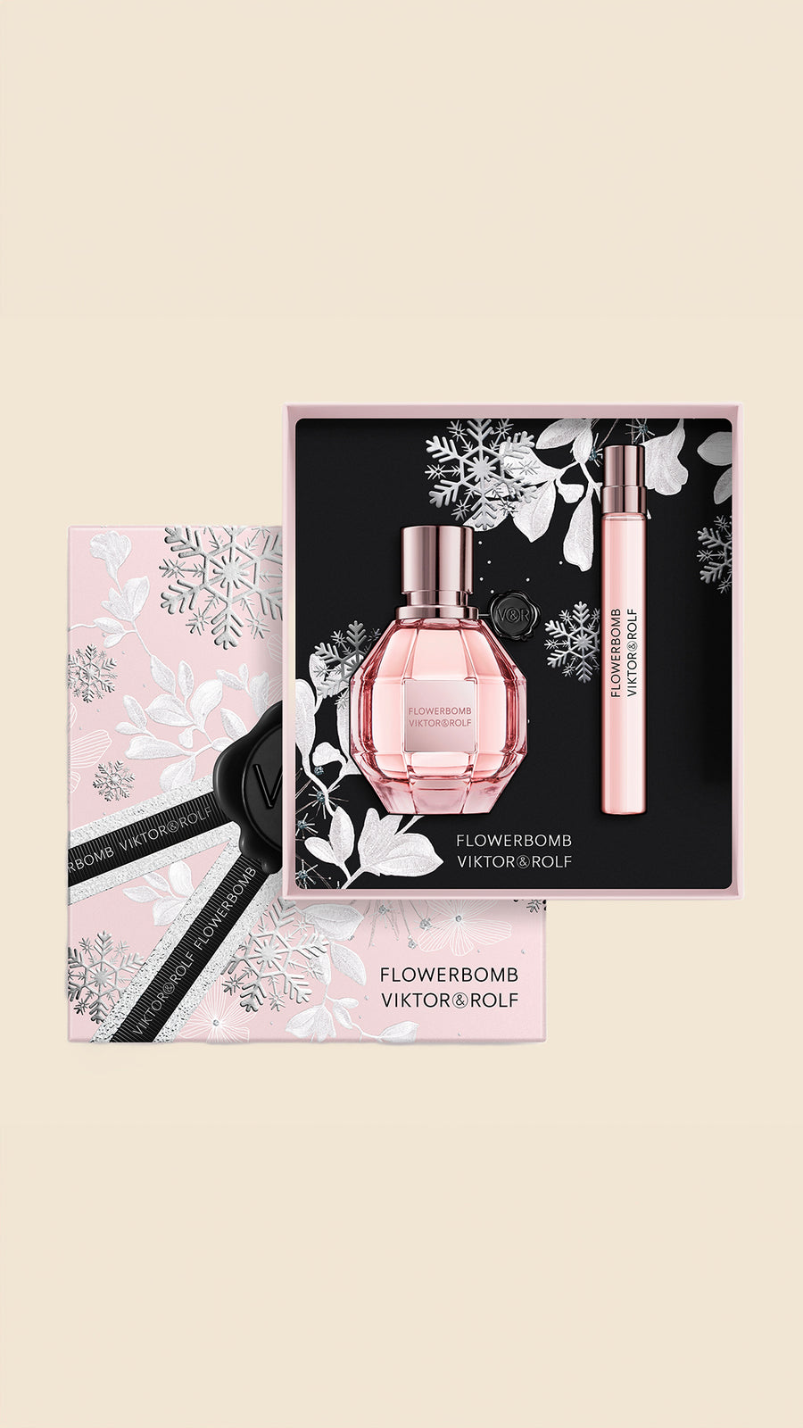 A luxurious Flowerbomb gift set for women by Viktor & Rolf, featuring an elegant pink bottle and floral-themed packaging.