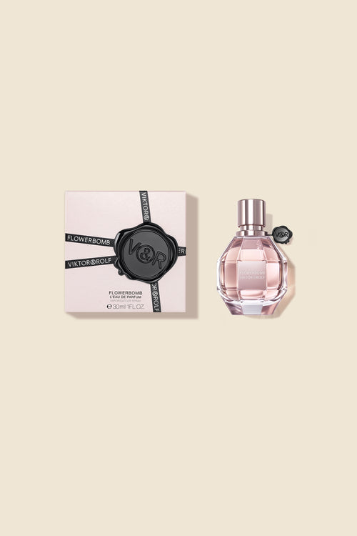 Elegantly designed Flowerbomb Eau de Parfum bottle for women, featuring a faceted glass and a luxurious pink hue.