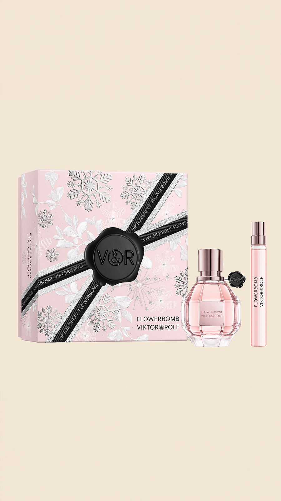 Elegant pink Flowerbomb gift set by Viktor & Rolf, featuring a faceted perfume bottle and sleek, floral-themed packaging for women.