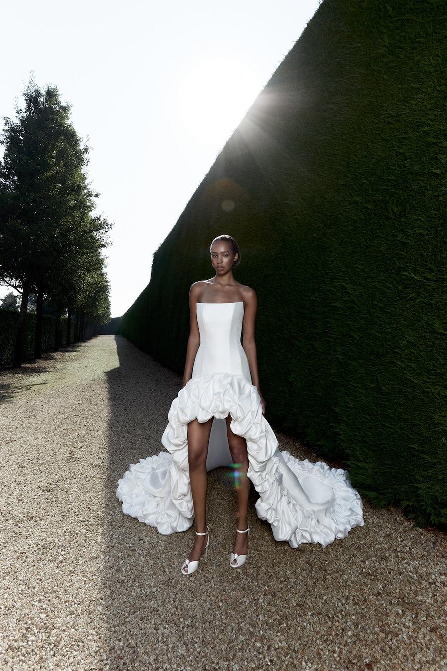 Bustled border high-low gown from Viktor & Rolf Mariage Bridalwear Collection, elegant design with exquisite detail.