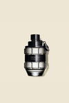 Elegant grenade-shaped fragrance bottle with a matte black finish and clear glass accents, designed by a luxury brand.