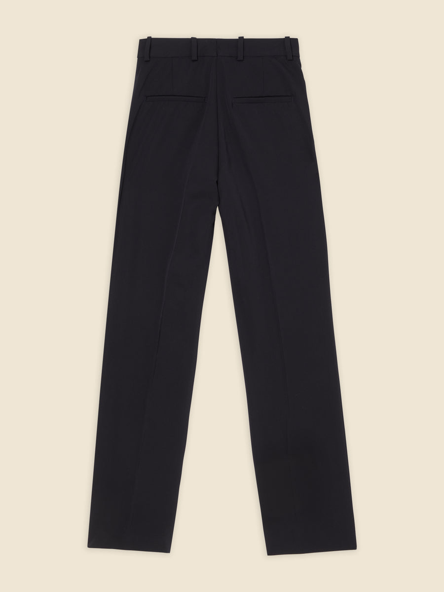 Tailored black dress pants featuring a sleek design with button and belt loops, highlighted against a neutral background.