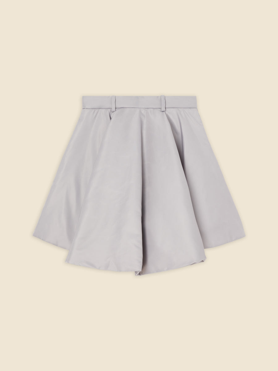 High-waisted A-line skirt in soft gray fabric with structured pleats and belt loops, creating a chic and versatile look.