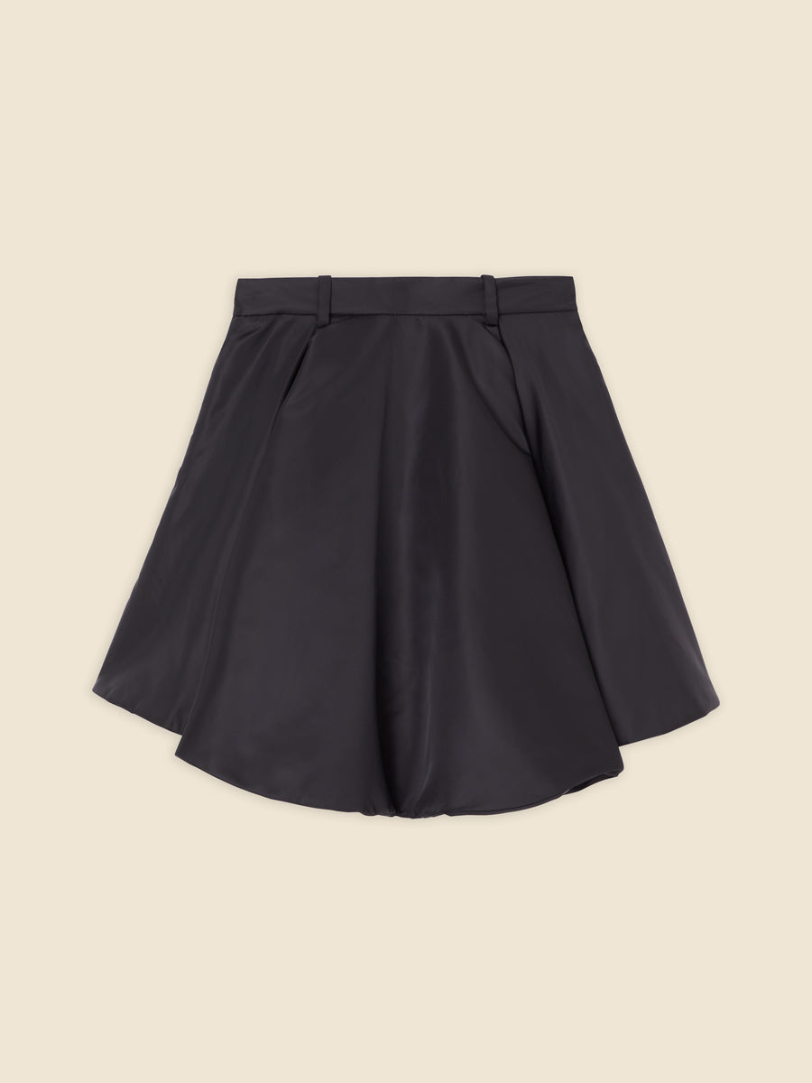 A-line skirt in sleek black satin with structured pleats and subtle sheen, perfect for elegant evening wear.