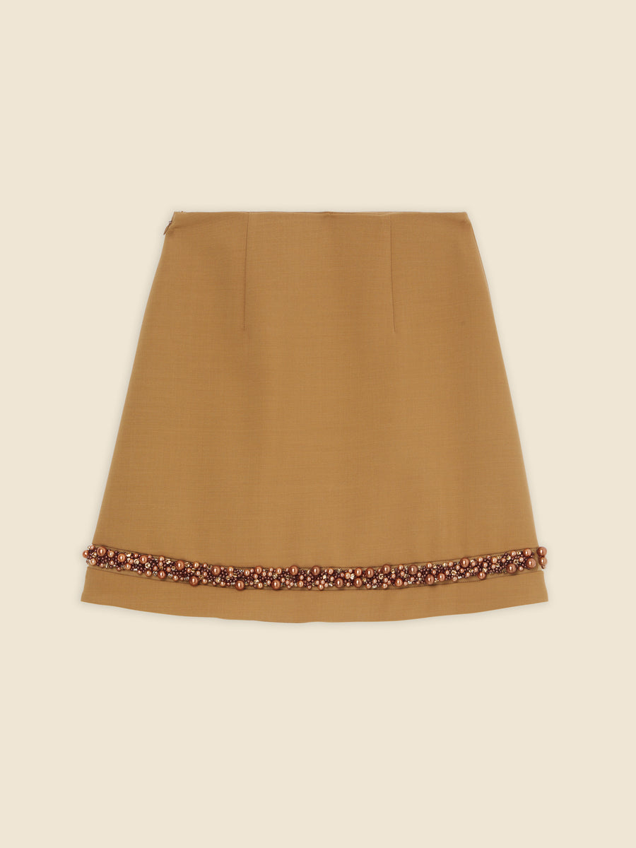 A-line brown skirt with intricate beaded hem detailing, crafted from smooth fabric for a sophisticated and stylish look.