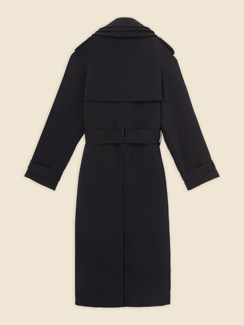 Elegant black wool trench coat featuring a structured back flap, belted waist, and adjustable cuff straps.