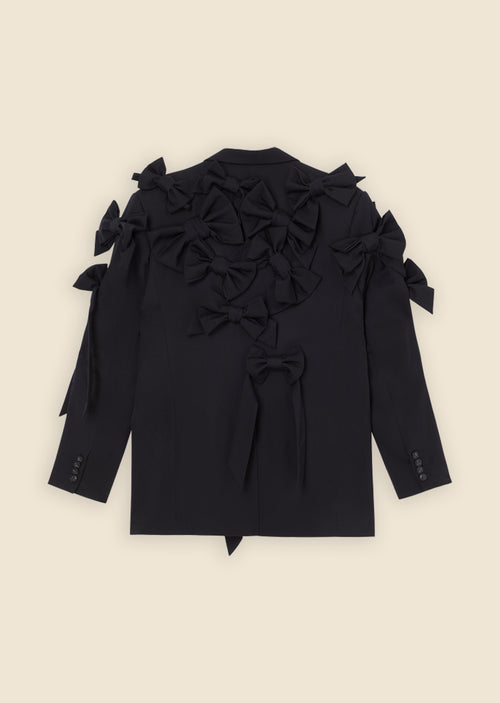 Black blazer adorned with multiple large bows, offering a unique and stylish design on a light background.