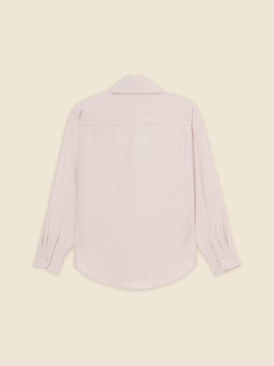 Back view of a light pink long-sleeve collared shirt on a neutral background. Elegant design with buttoned cuffs.