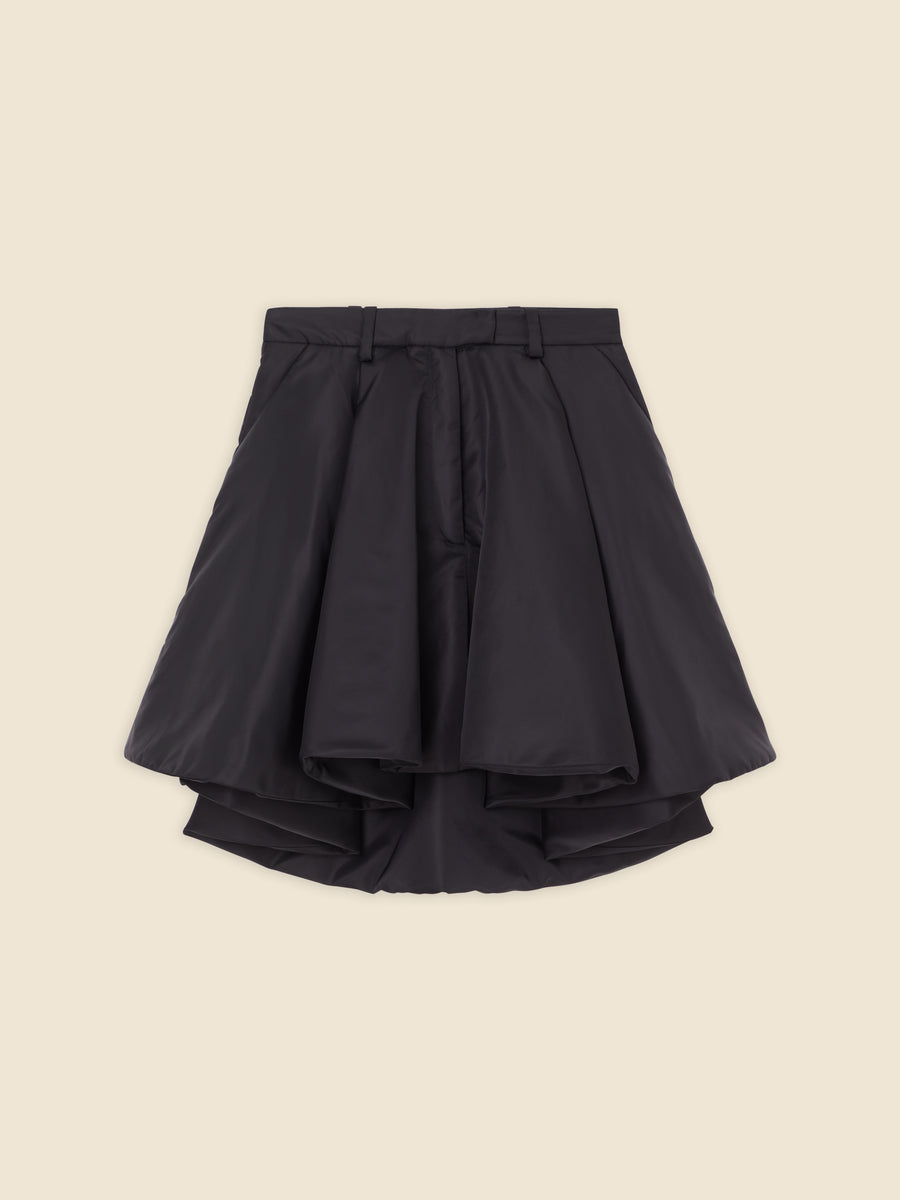 A voluminous black satin high-waisted skirt with layered ruffles, showcasing elegant tailoring and luxurious texture.