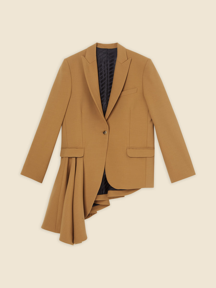 Asymmetrical mustard blazer with pleated drape detail on beige background, featuring notched lapels and single-button closure.