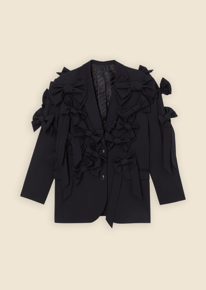 Black blazer adorned with multiple decorative bows, showcasing a unique and stylish fashion statement.