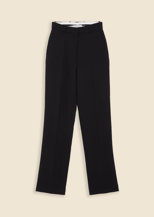 Elegant black tailored pants with a high waist and subtle crease, designed for a sophisticated and timeless look.